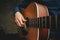 Man`s hands playing acoustic guitar. Singer playing guitar