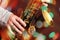 Man`s hands with saxophone on bokeh lights