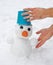 Man\'s hands sculpt snowman