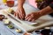 Man\'s hands touch sushi rolls.