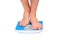 Man\'s legs ,weighed on floor scale.