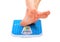 Man\'s legs ,weighed on floor scale.