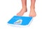 Man\'s legs ,weighed on floor scale.