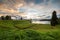 Man\'s monastery on the bank of lake on a sunset