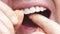 a man's mouth close-up. a man brush your teeth with dental floss.