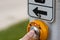 Man\\\'s thumb pressing crosswalk button