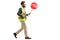 Man in a safety vest holding a stop traffic sign walking