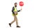 Man in a safety vest holding a stop traffic sign walking and loo