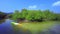 Man sailing sea kayak in  magrove canal