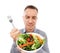 Man with salad, frown on face and vegetables, problem with healthy lifestyle and diet isolated on white background