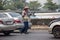 Man Sale Flower on Road Intersection