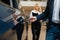 Man and saleswoman choosing auto in car dealership