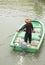 Man on sampan boat