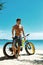 Man With Sand Bike On Beach Enjoying Summer Travel Vacation