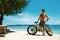 Man With Sand Bike On Beach Enjoying Summer Travel Vacation