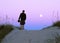 Man on sand dunes at twilight