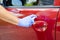 Man sanitizing door handle of his car outdoors.  Male hand in protective glove holding sanitizer closeup