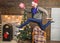 Man santa hat hurry to deliver gift on time. Christmas is coming. Spread happiness and joy. Bearded guy in motion jump