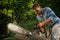 Man sawing a log