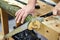 Man sawing wood handsaw