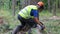 Man sawing wood using chainsaw