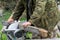 A man saws an old stove Board on a circular saw, close-up, selective focus. Stove heating, rural life.