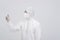 Man scientist wearing biological protective uniform suit clothing, mask, gloves with hand sanitizer dispenser for sanitizing virus