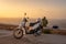 A man with scooter on the top of El Toro Mountain on Menorca in Spain