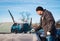 Man scraping front windshield