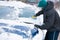 Man Scraping Ice off Car