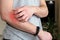 A man scratching an itchy hand. Dermatitis, eczema, allergies, psoriasis. Close-up of a man with an itchy rash on his