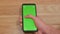 Man Scrolls Smartphone Green Screen