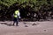 Man Search for Metals with Metal Detector
