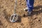 Man searching for treasure with metal detector.