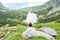 Man seated in front of Velicke Pleso, High Tatras, Slovakia