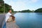 Man on seawall on vacation