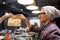 Man seller giving paper bag to customer at cafe