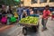 Man selling avocado on the street of Medellin Colombia