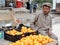 Man selling oranges on the streets of Karbala, Iraq