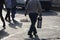 Man selling tea in thermos on the street. In his other hand, he carries glass glasses on a handle tray