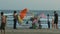 Man Sells Kites People Play Kids Have Fun in Ocean