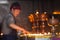 The man serves oil lamps in the temple. On March 9, 2017, Kathmandu. Nepal.