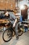 Man serving bicycle in the workshop