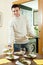 Man serving cooked fish on the table