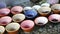 Man serving food in colorful pots.