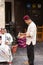 Man serving tea to local man at Souk Wakif in Doha