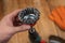 Man set up knot cup wire brush in cam of an electric drill chuck. Tool for woodworking, sanding, removing rust from various