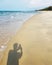 Man shadow taking photo at beach