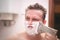 Man shaving.