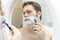 Man shaving.